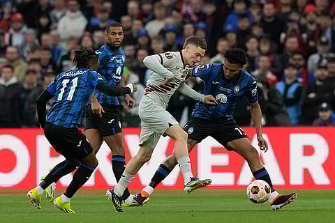 Florian Wirtz is challenged by Ademola Lookman and Ederson